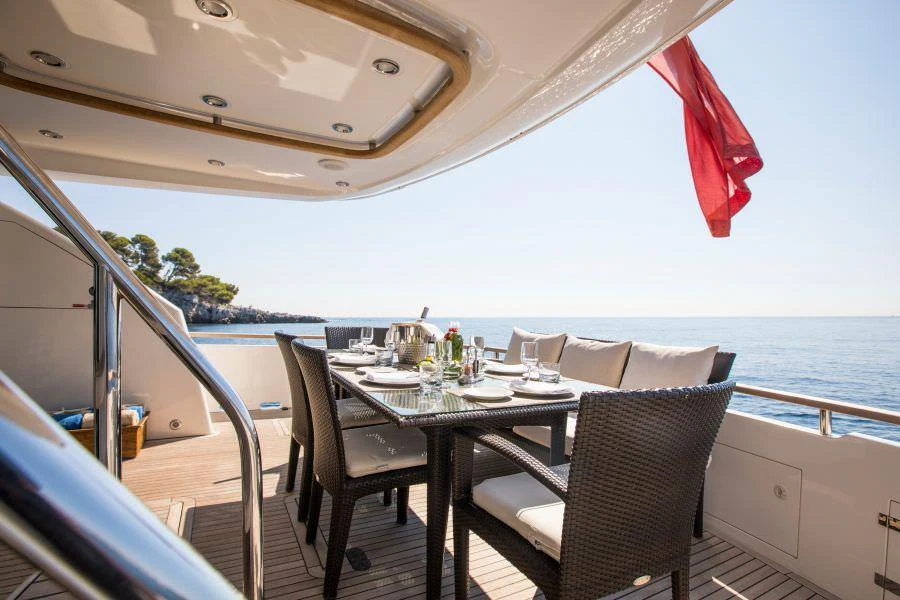 a table and chairs on a boat aboard D5 Yacht for Charter