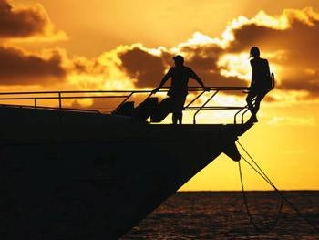 a couple of men fishing aboard SORANA Yacht for Charter