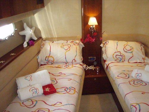 a couple of beds in a hotel room aboard SORANA Yacht for Charter