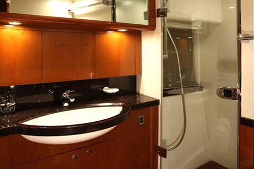 a bathroom with a sink and shower aboard SORANA Yacht for Charter