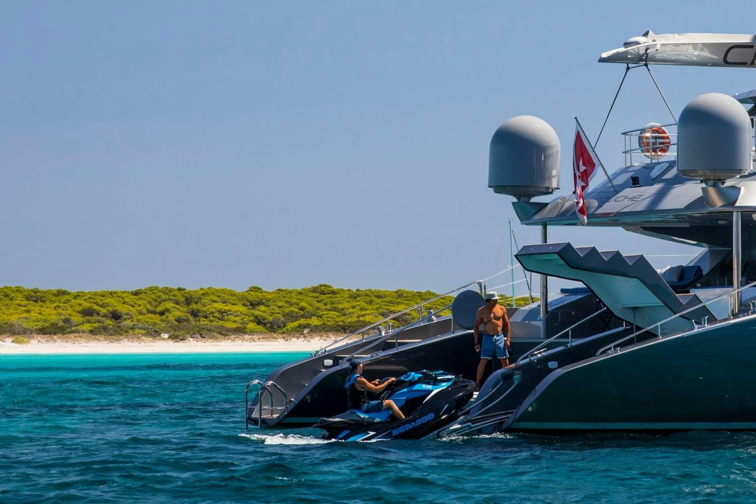 a couple of people on a boat aboard CARTOUCHE Yacht for Charter