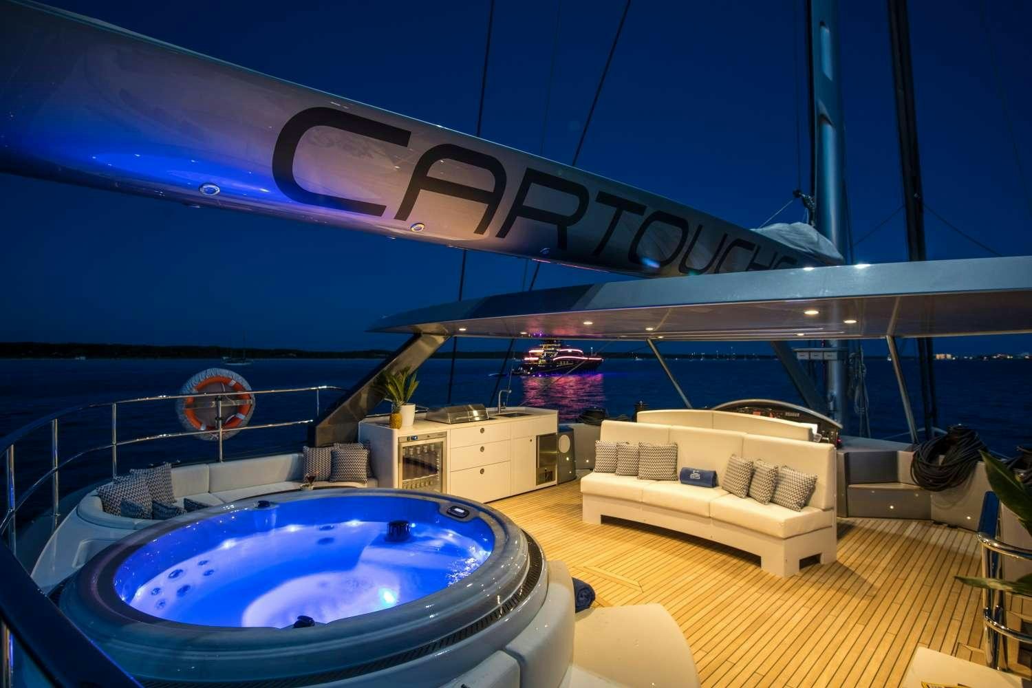 a large swimming pool aboard CARTOUCHE Yacht for Charter