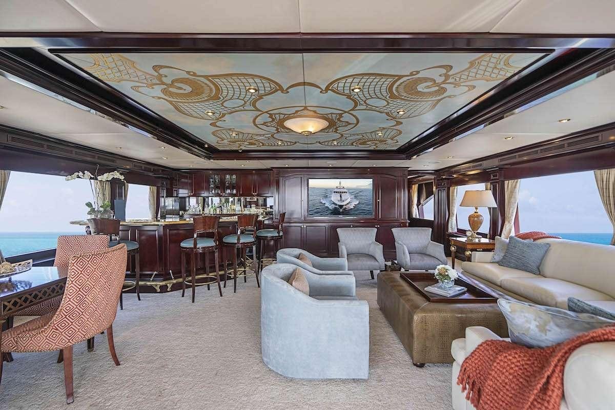 a large living room with a large open window aboard MISS CHRISTINE Yacht for Charter