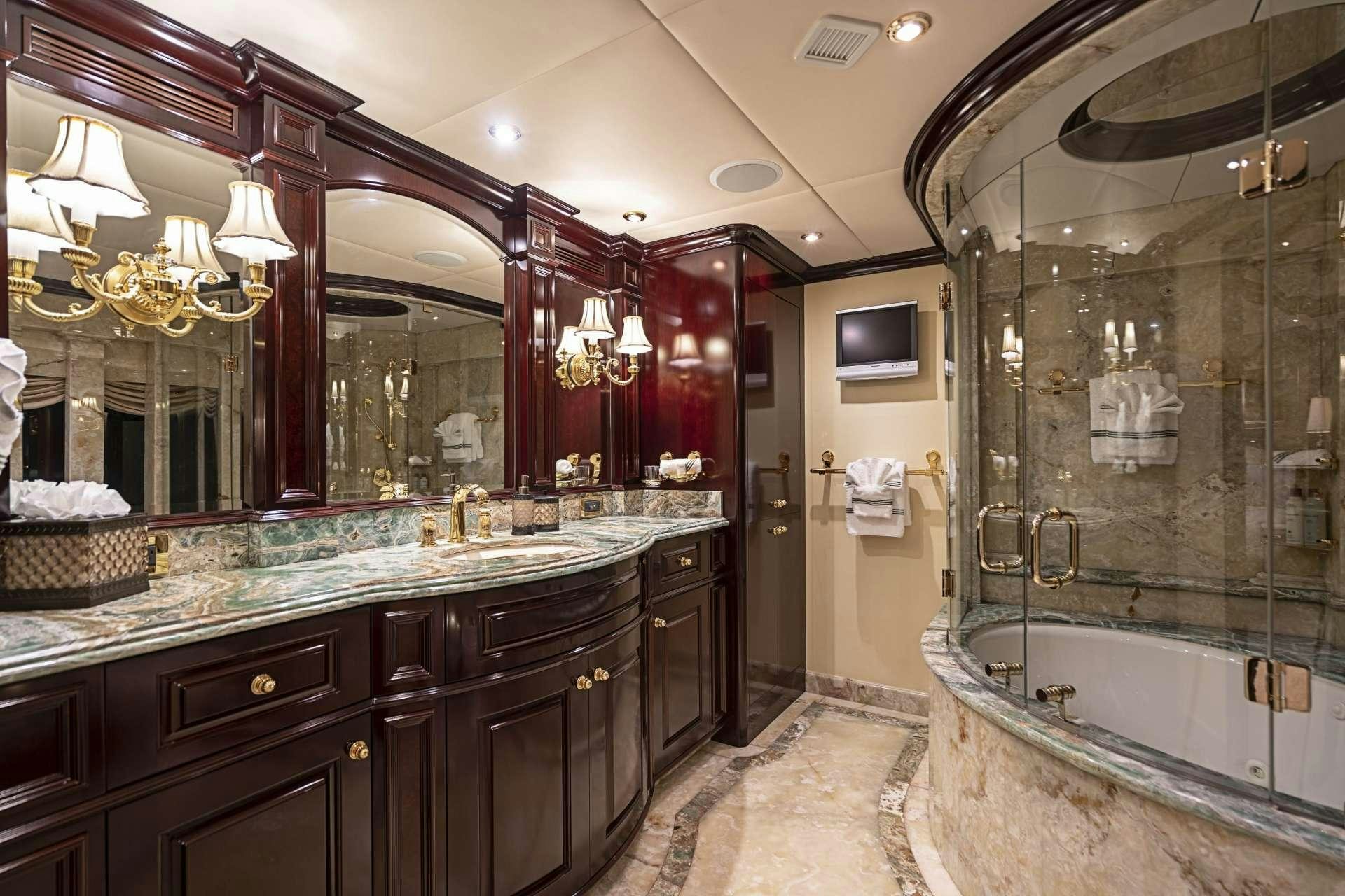 a bathroom with a large marble countertop aboard MISS CHRISTINE Yacht for Charter