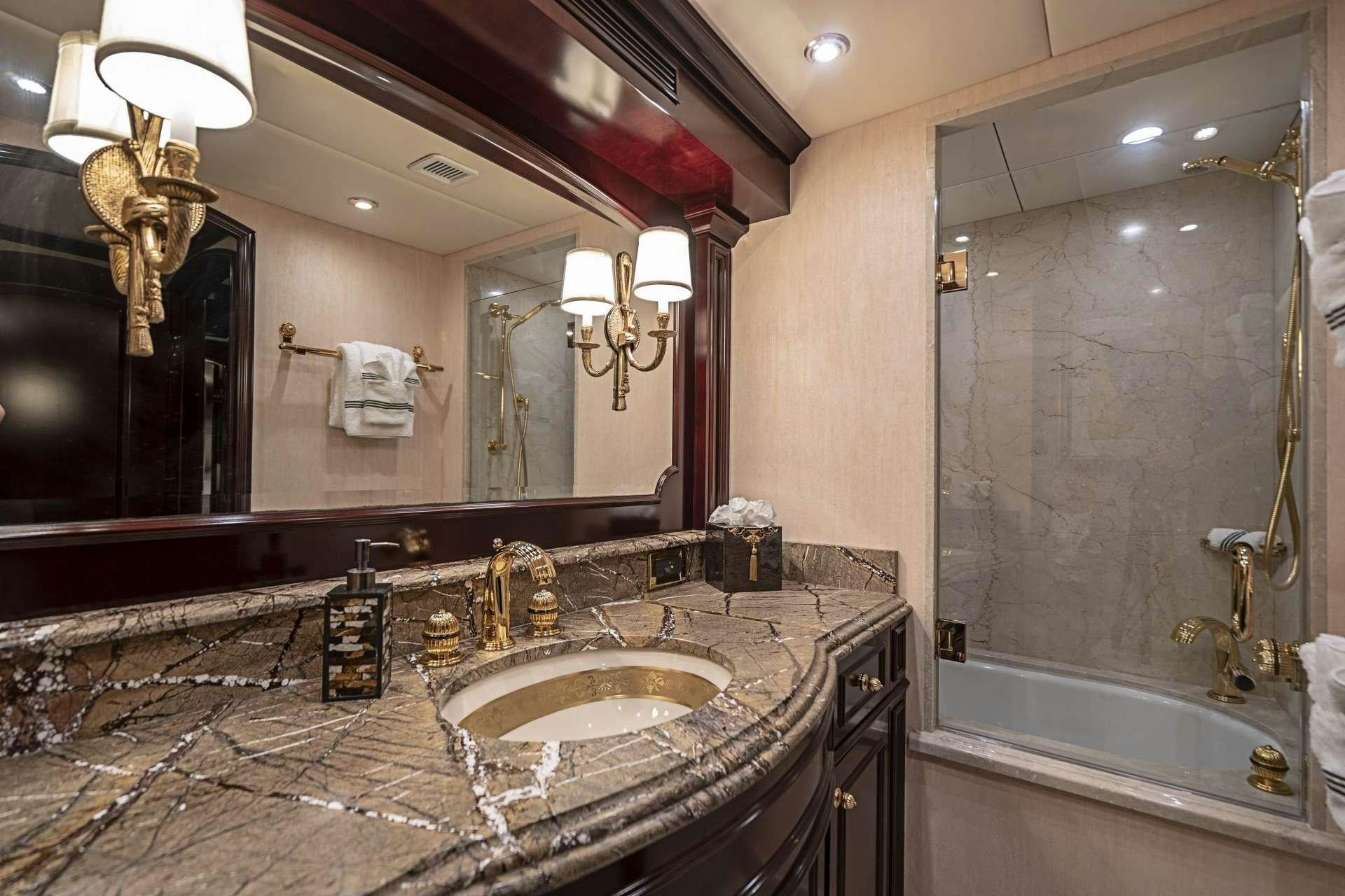 a bathroom with a large mirror aboard MISS CHRISTINE Yacht for Charter