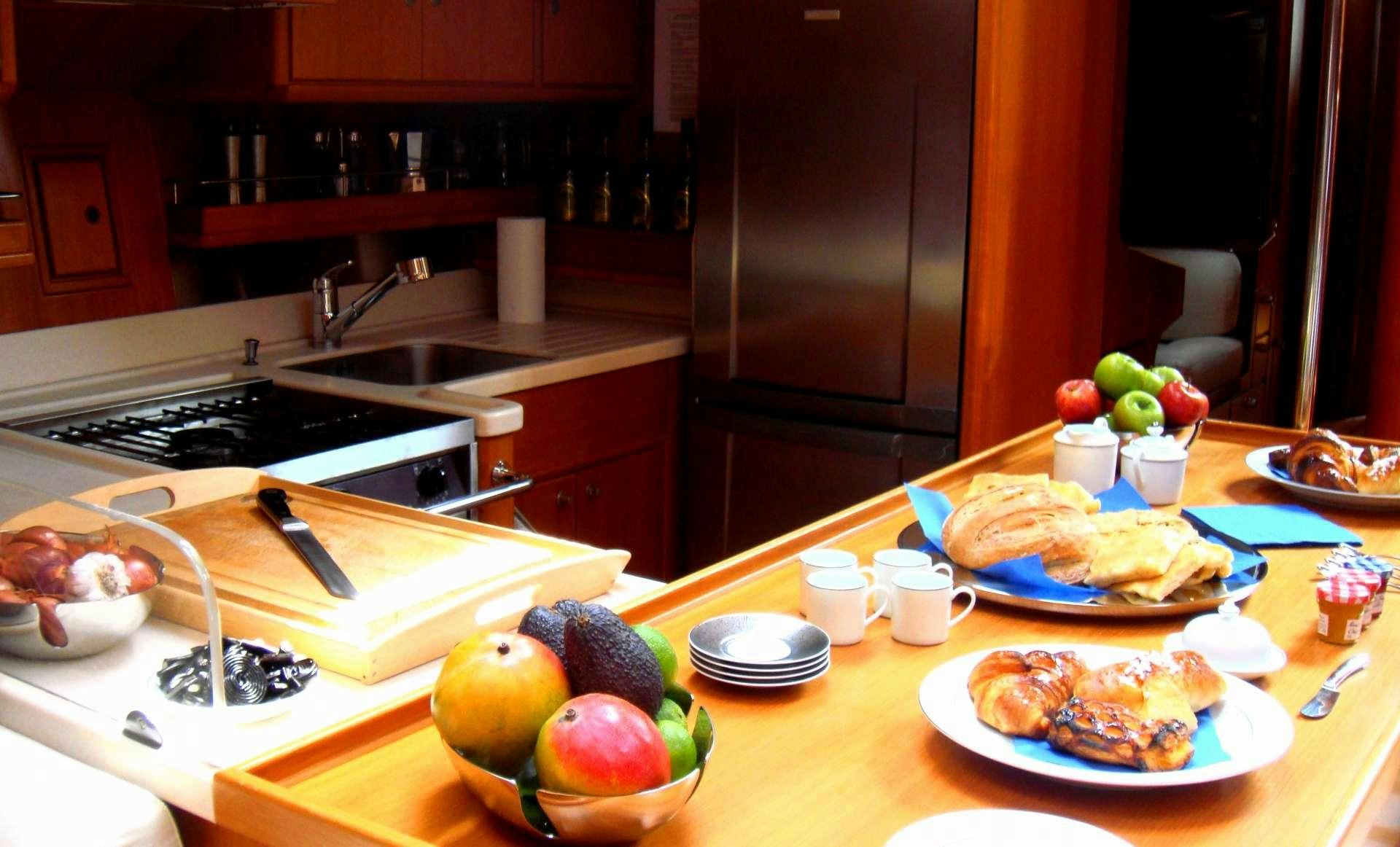 a kitchen counter with food on it aboard VOLADOR Yacht for Charter