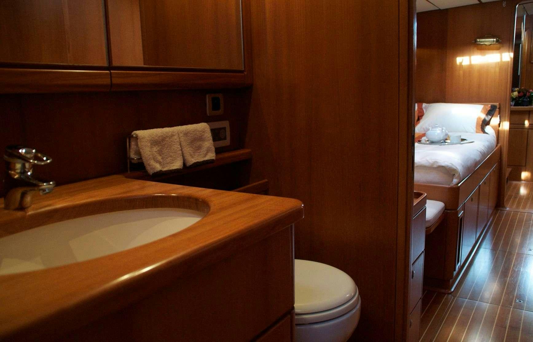 a bathroom with a sink toilet and a bathtub aboard VOLADOR Yacht for Charter