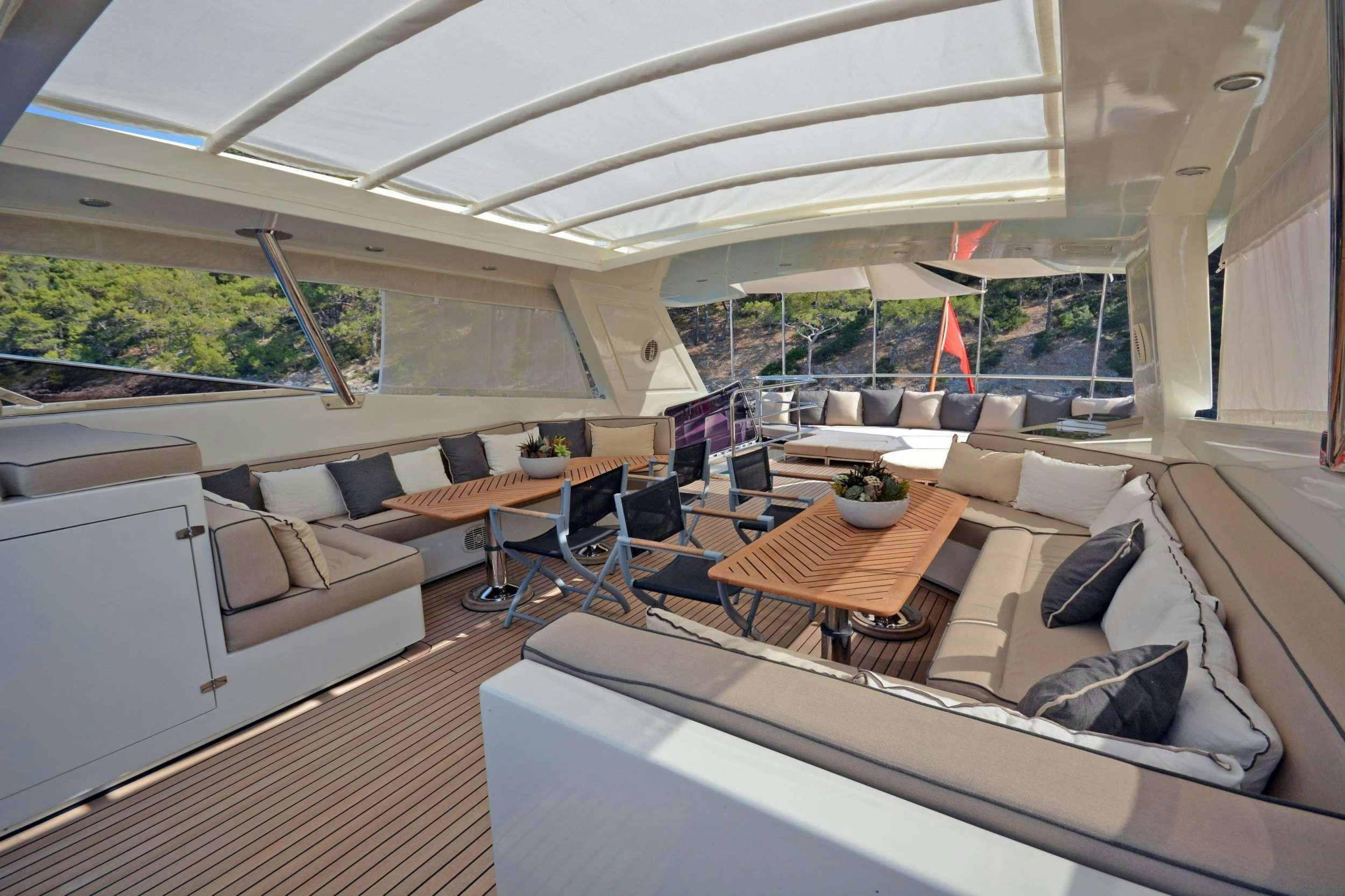 a living room with a couch and a table aboard GO Yacht for Charter