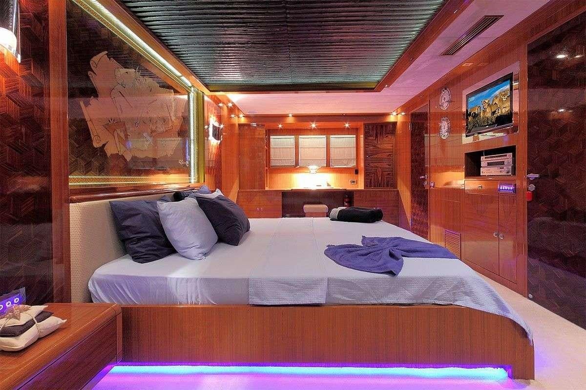 a bed in a cabin aboard GO Yacht for Charter