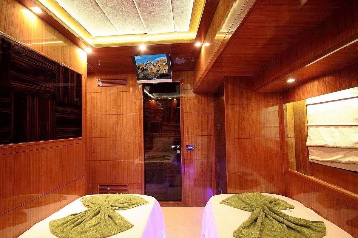 a room with a table and chairs aboard GO Yacht for Charter