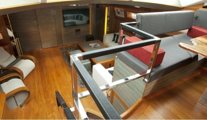 a room with a couch and a table aboard SILVERLINING Yacht for Charter