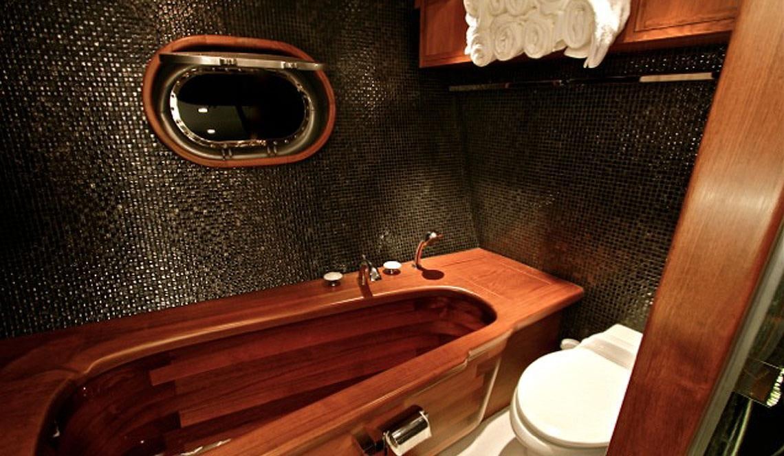 a bathroom with a round mirror aboard SILVERLINING Yacht for Charter