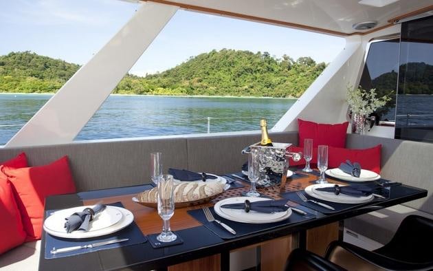 a table with plates and glasses on it aboard SILVERLINING Yacht for Charter