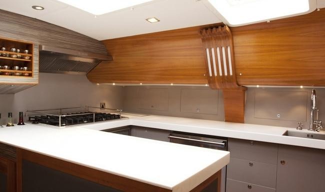 a kitchen with white cabinets aboard SILVERLINING Yacht for Charter