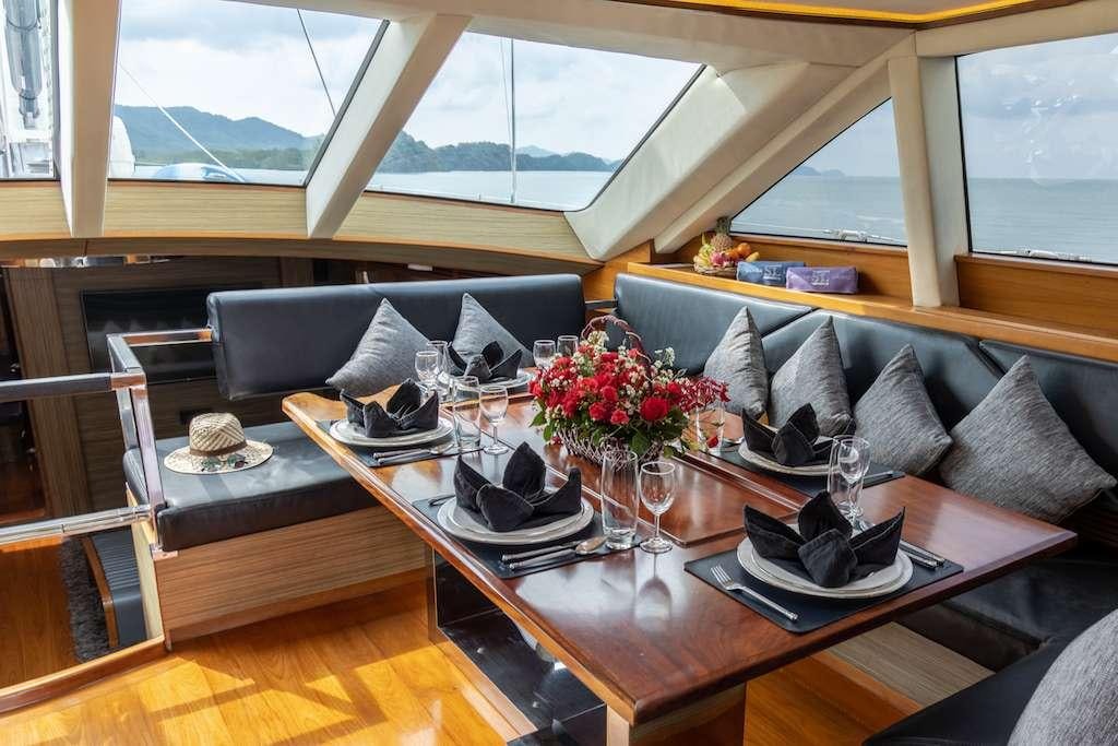 a living room with a large window aboard SILVERLINING Yacht for Charter