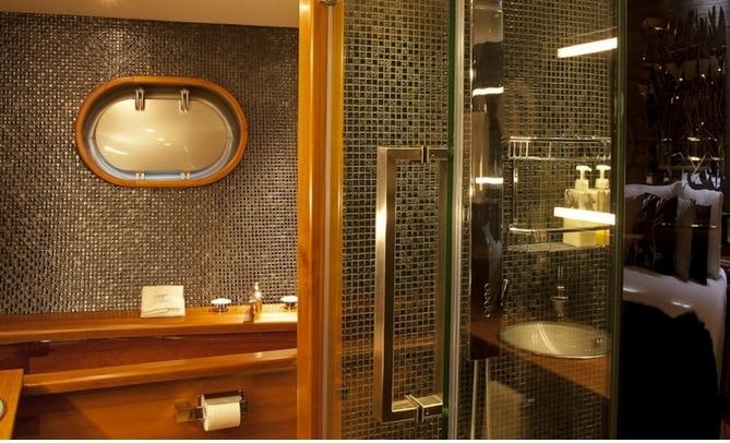 a bathroom with a large mirror aboard SILVERLINING Yacht for Charter