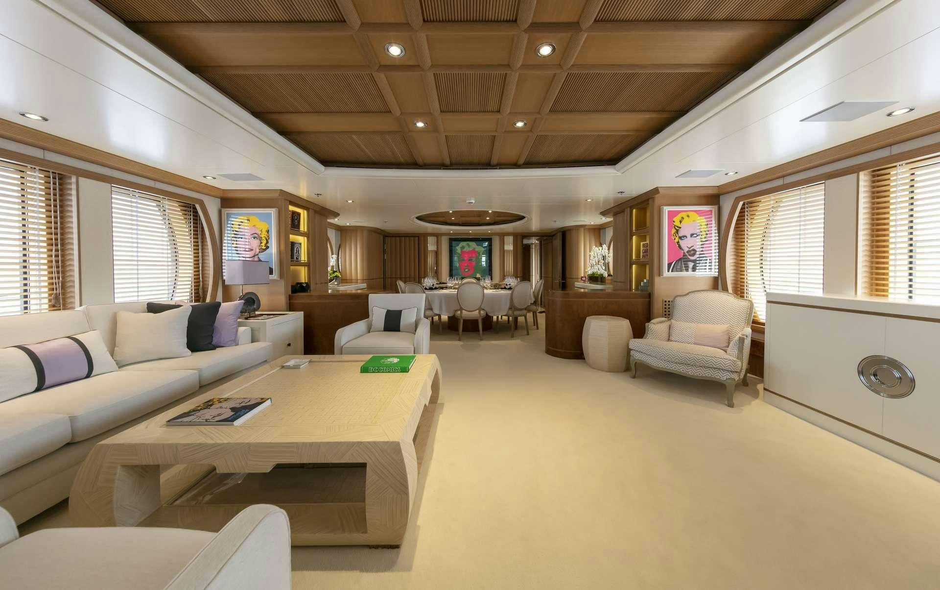 a living room with a couch and a table aboard MARLA Yacht for Charter