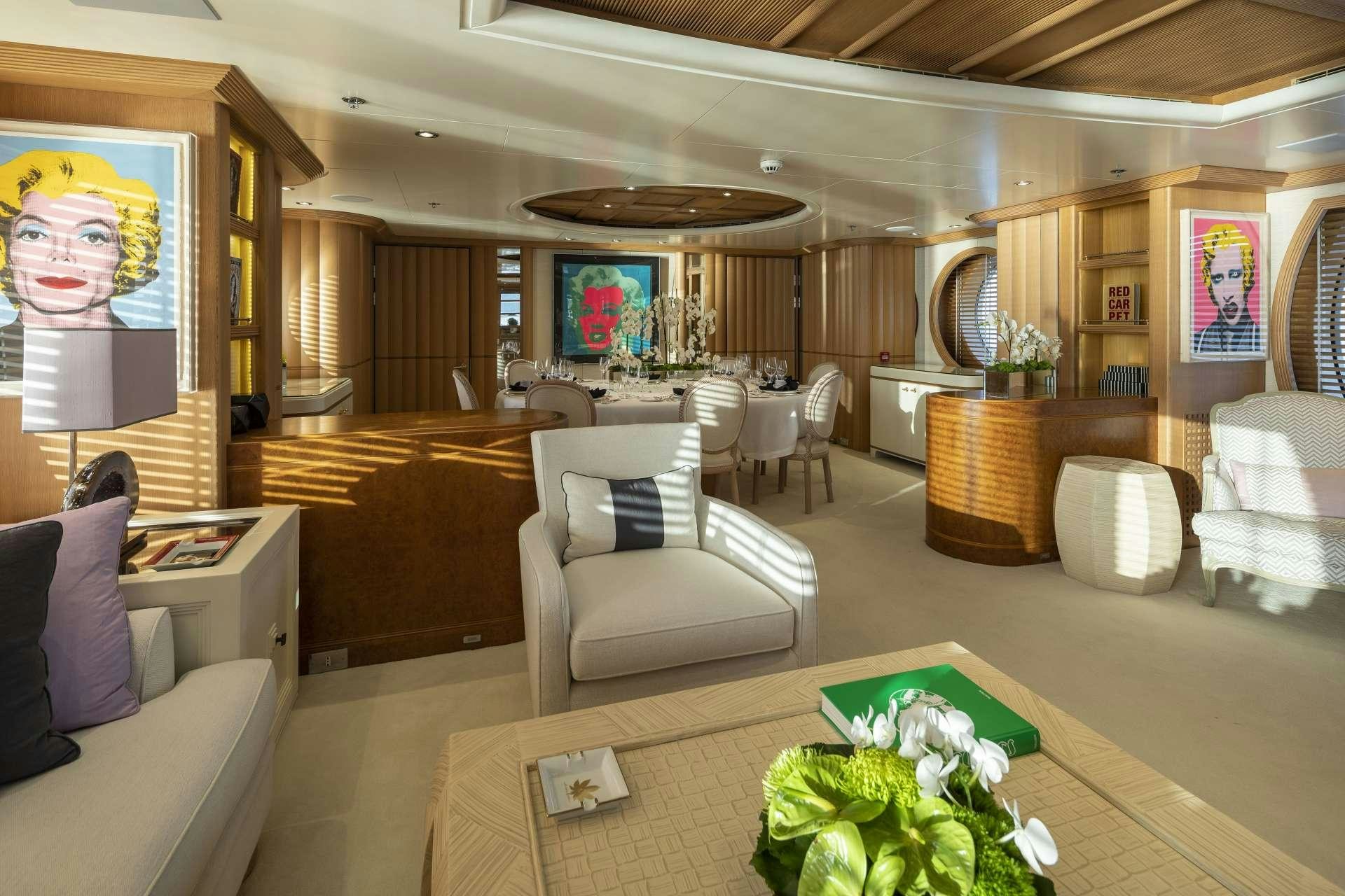 a living room with a large screen aboard MARLA Yacht for Charter