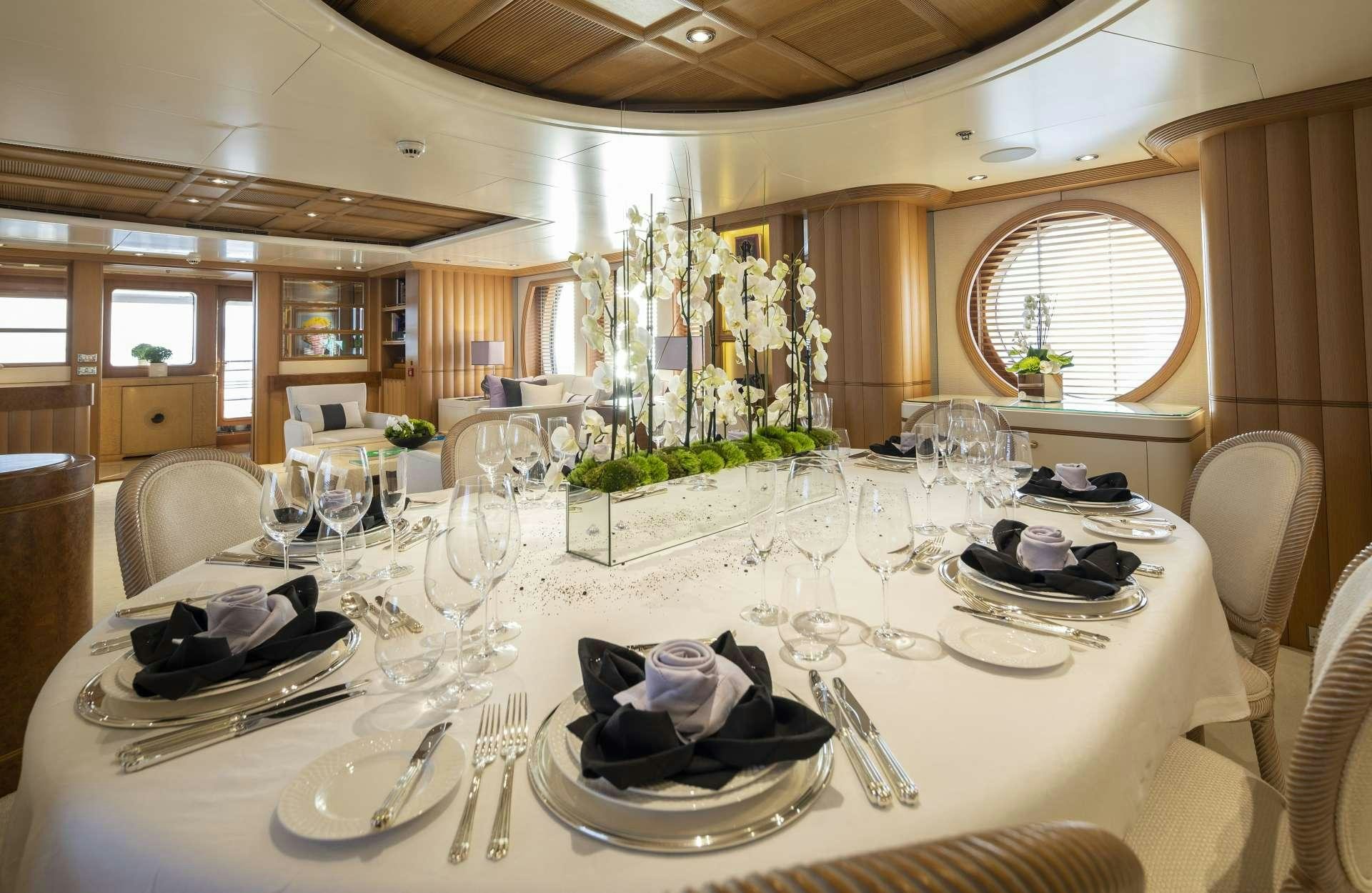 a dining room with a table set aboard MARLA Yacht for Charter