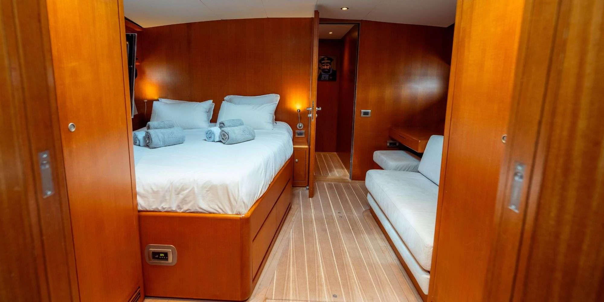 a room with two beds aboard IKIGAI Yacht for Charter