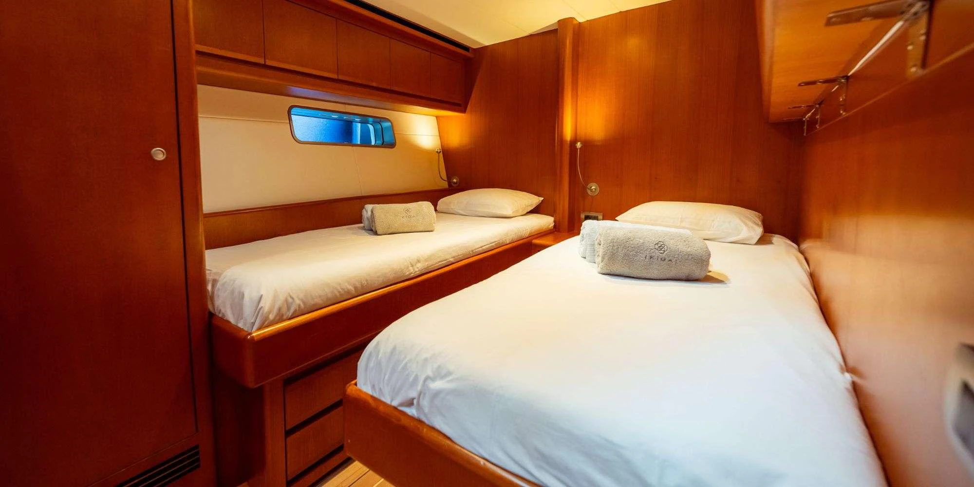 a room with two beds aboard IKIGAI Yacht for Charter