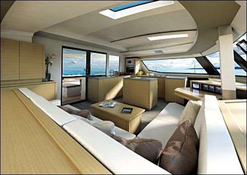 a room with couches and a tv aboard Ghost Yacht for Charter