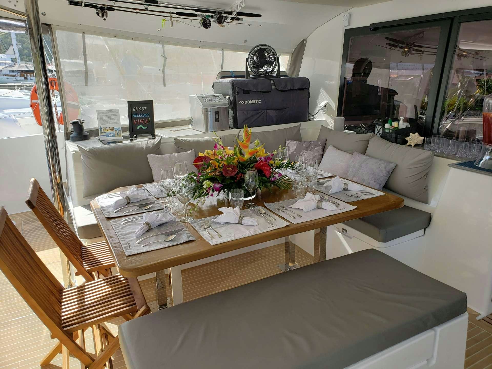 a dining table in a train aboard Ghost Yacht for Charter