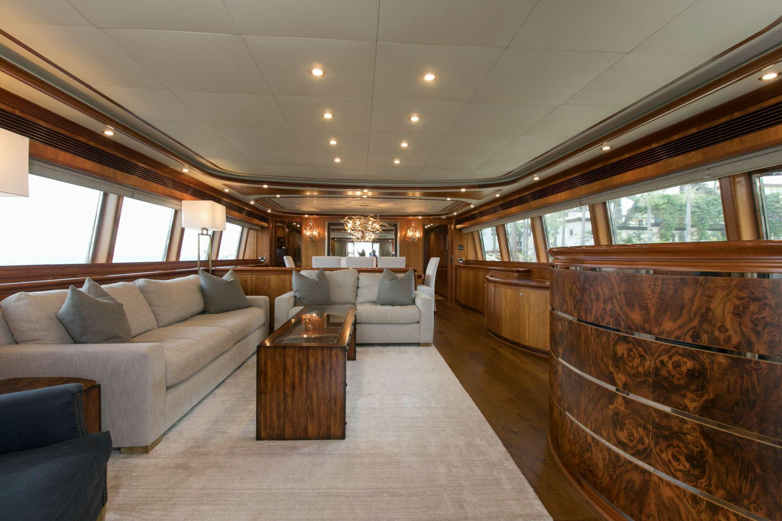 a living room with a couch and a coffee table aboard MAMBO Yacht for Charter