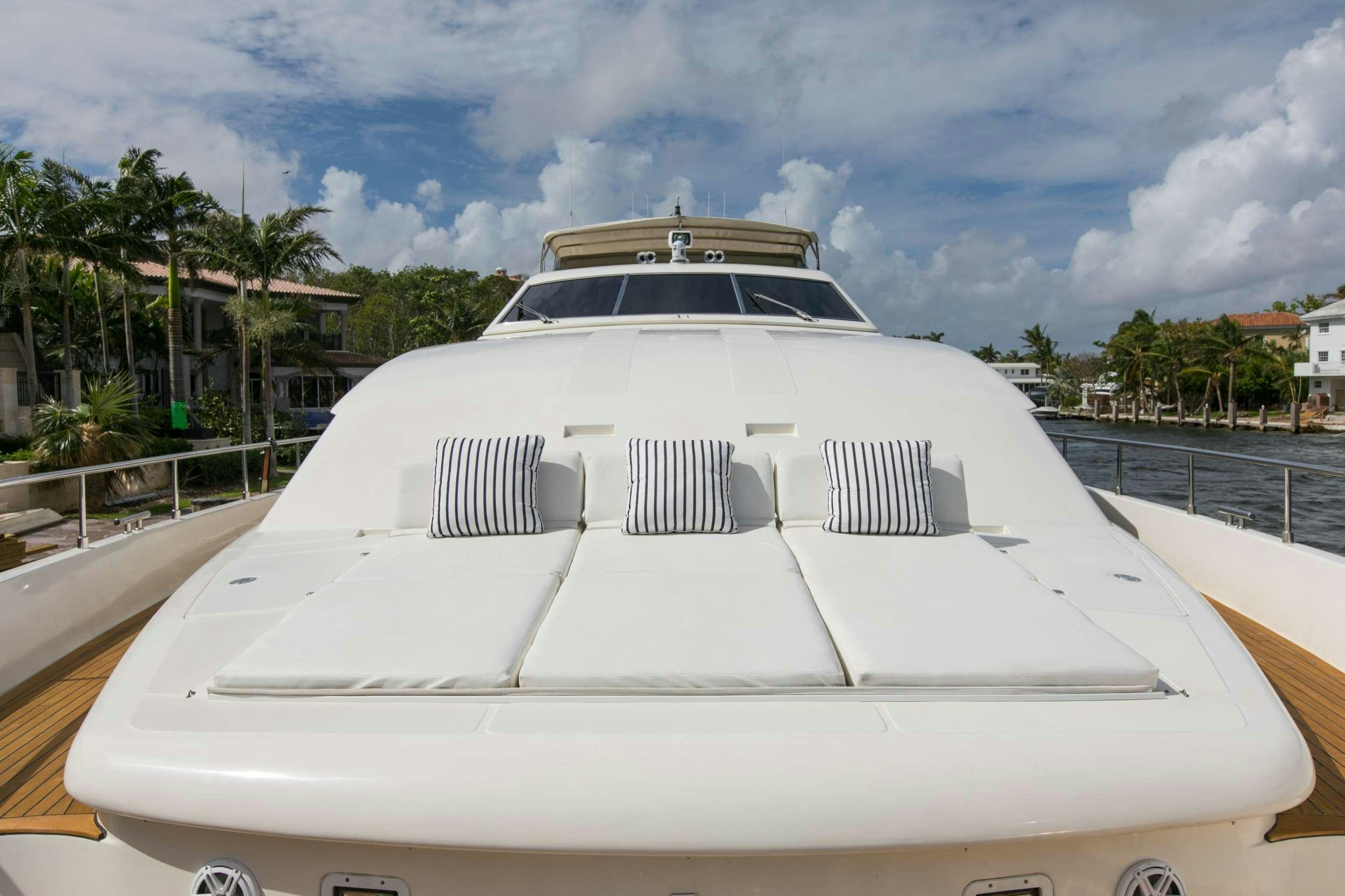 a white car on a road aboard MAMBO Yacht for Charter