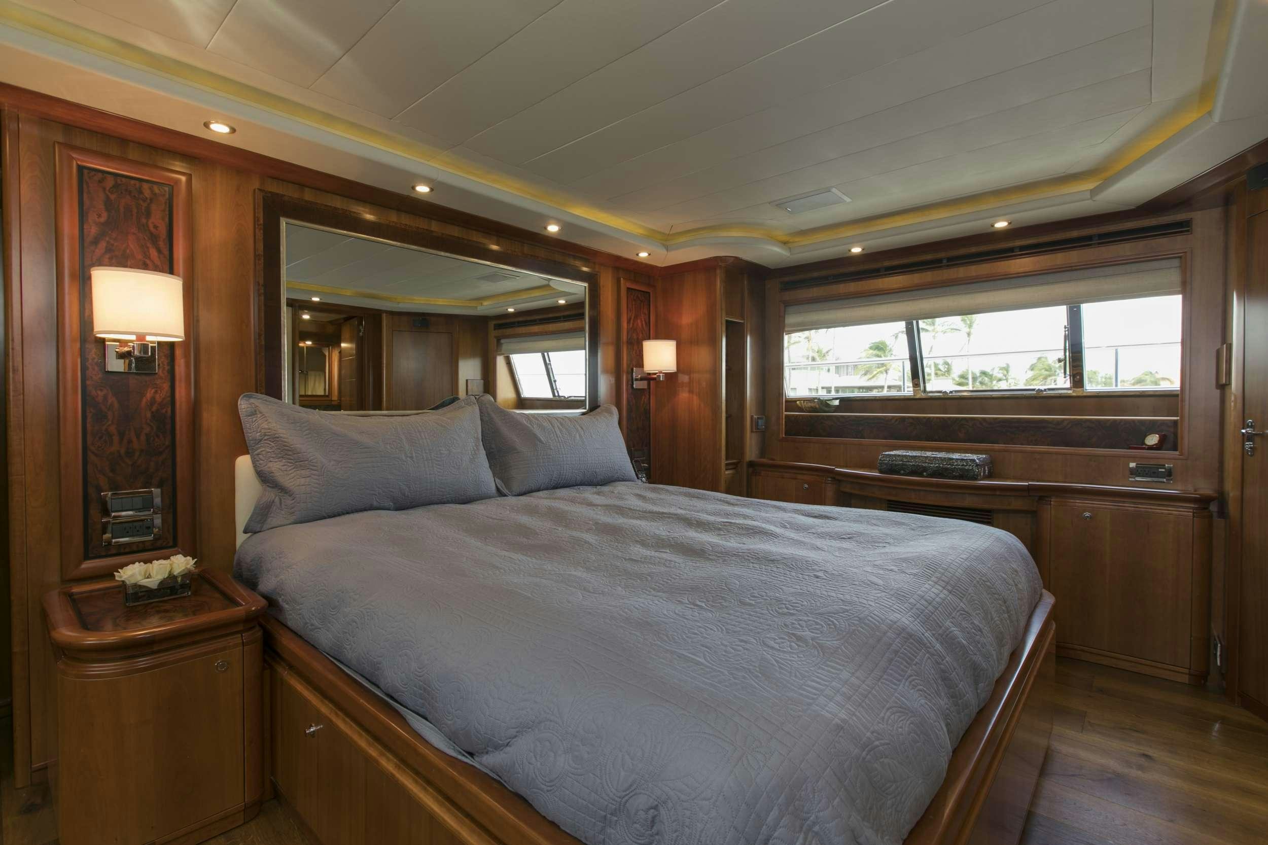 a bed in a room aboard MAMBO Yacht for Charter