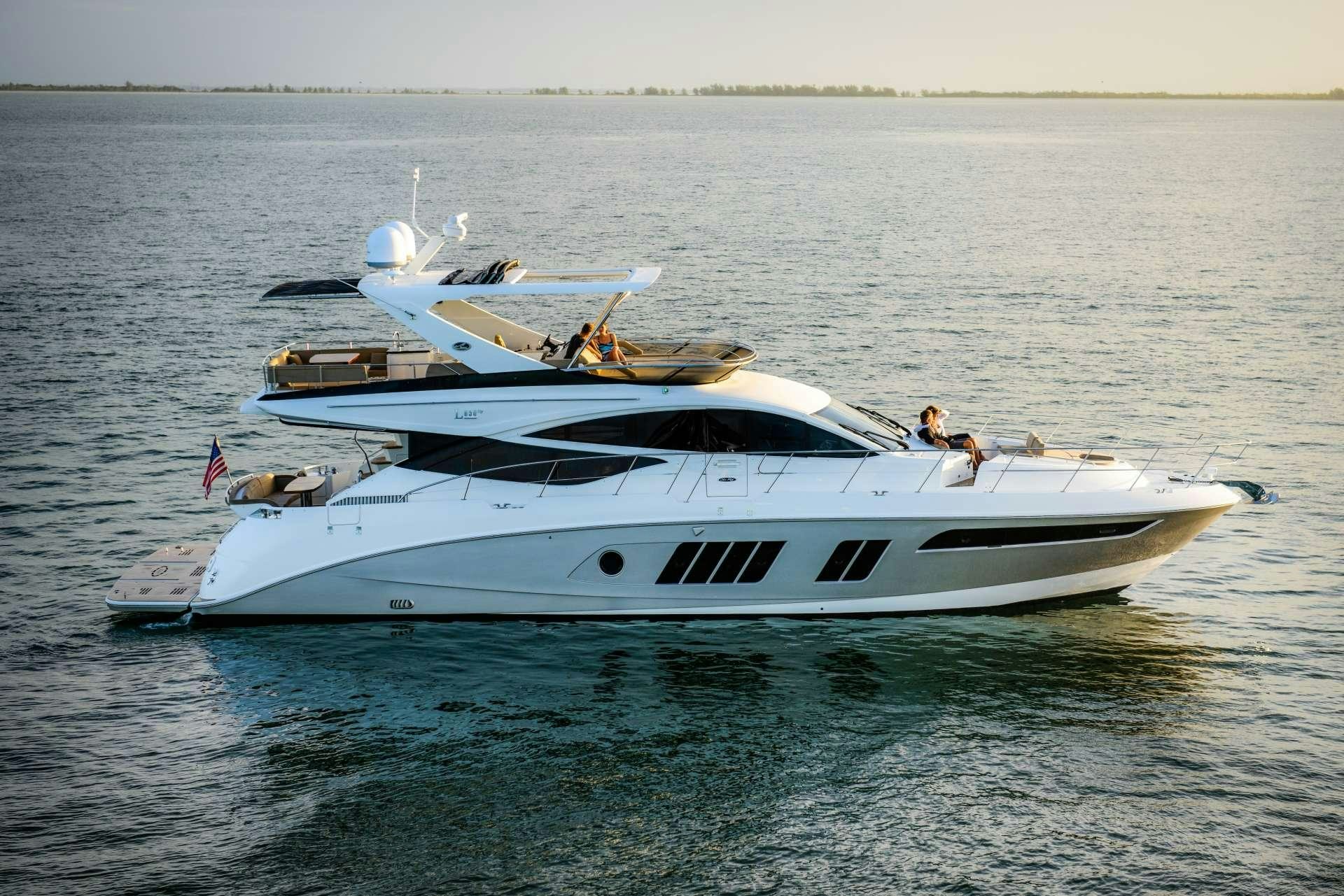 a white yacht in the water aboard KRAKEN Yacht for Charter