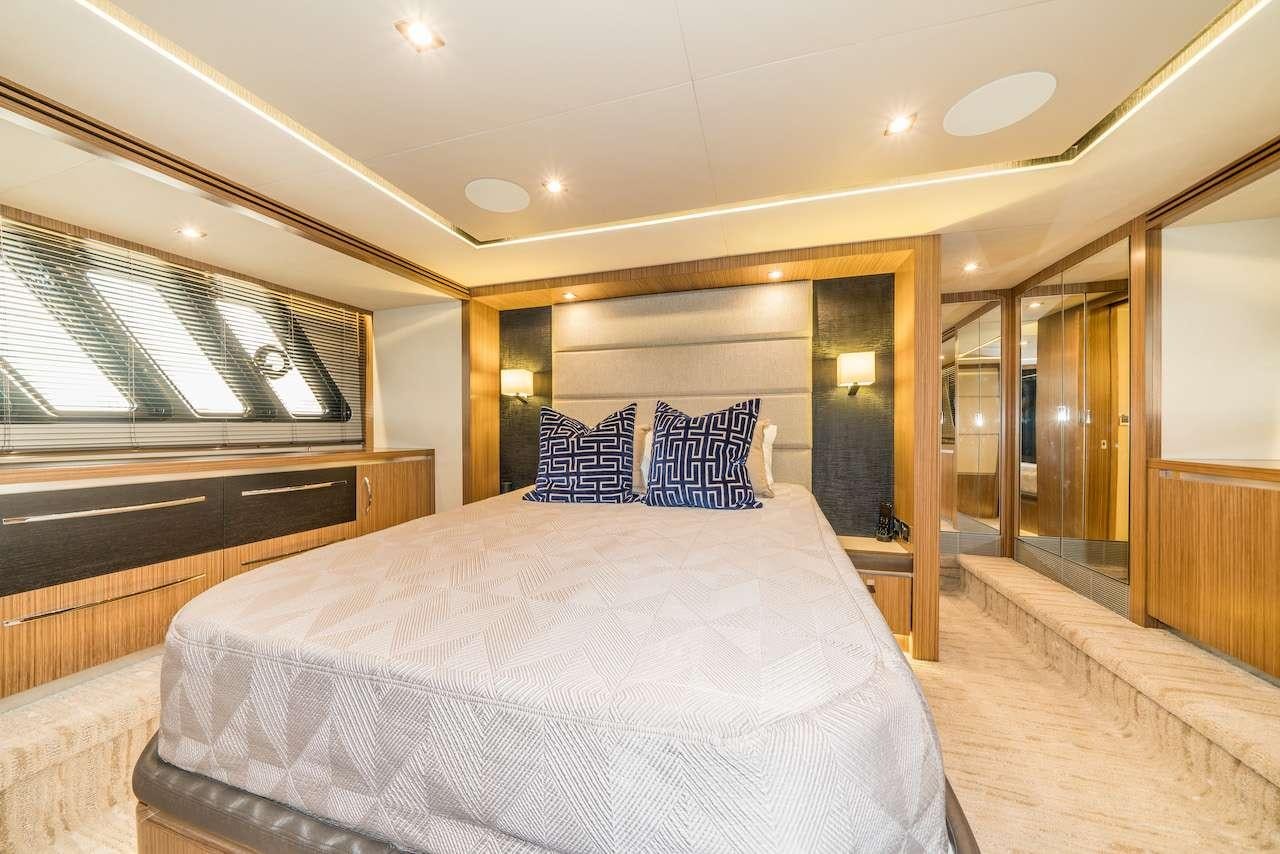 a large bed in a room aboard KRAKEN Yacht for Charter