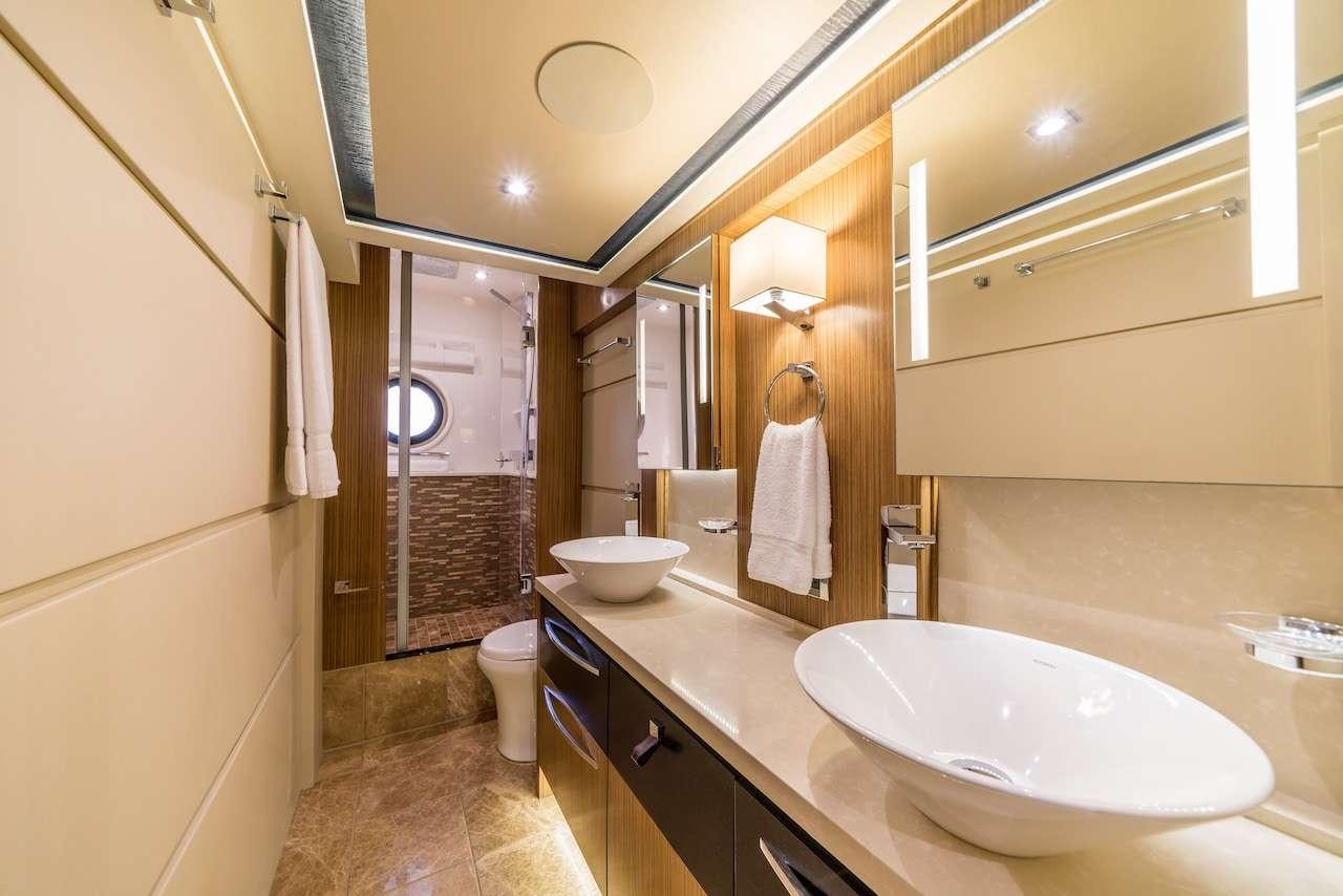 a bathroom with a sink and a bathtub aboard KRAKEN Yacht for Charter