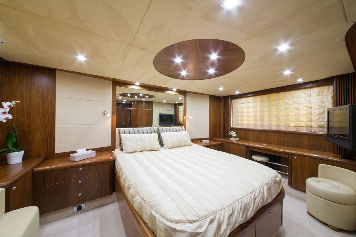 a large bedroom with a large bed aboard ASPIRE OF LONDON Yacht for Charter