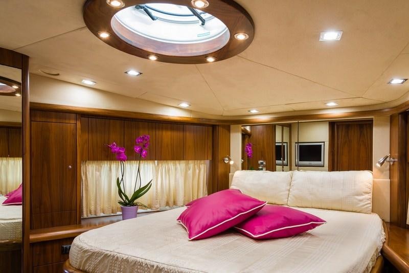 a large bed in a hotel room aboard ASPIRE OF LONDON Yacht for Charter
