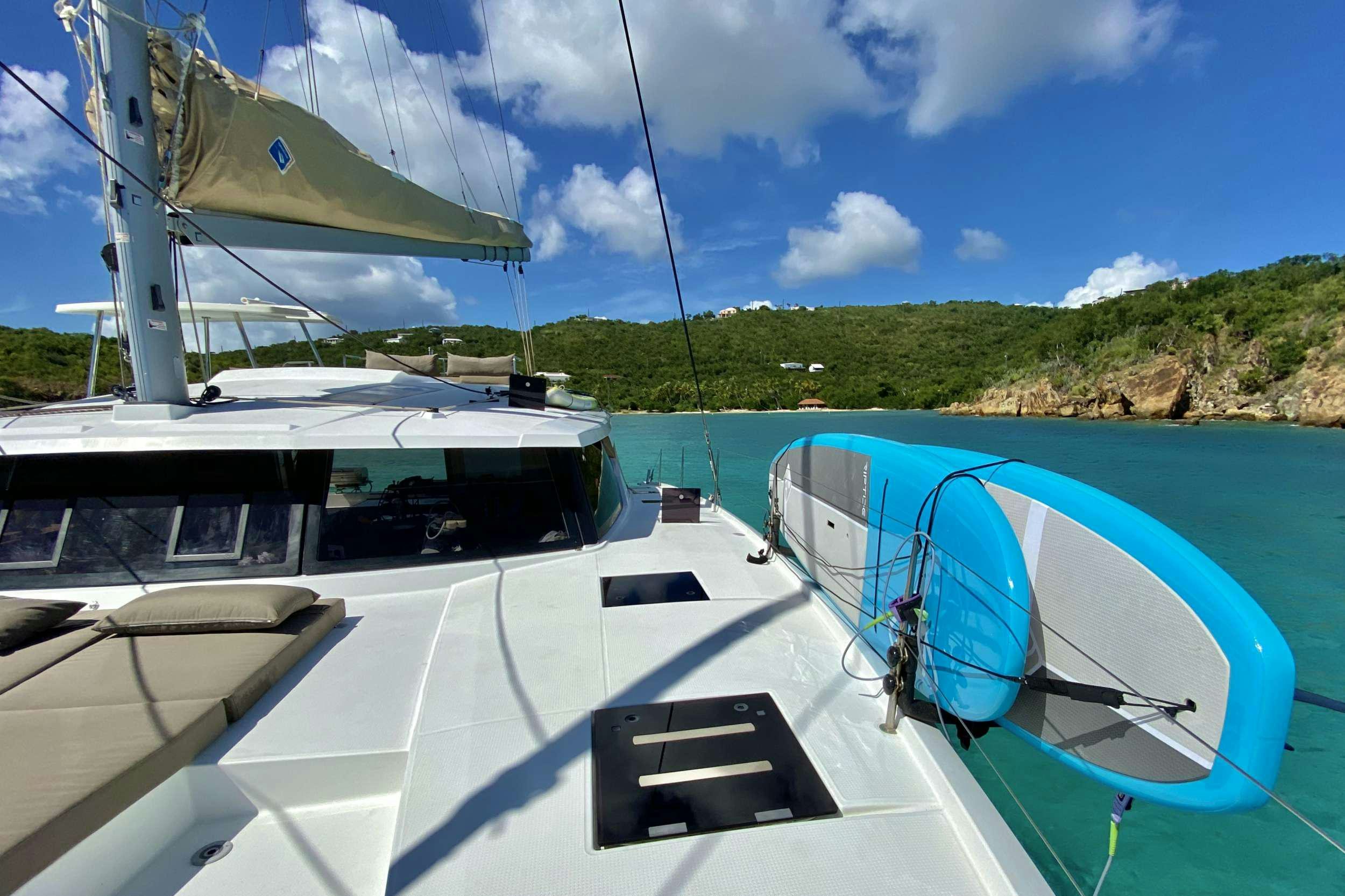 a boat docked at a pier aboard BLACK TORTUGA Yacht for Charter