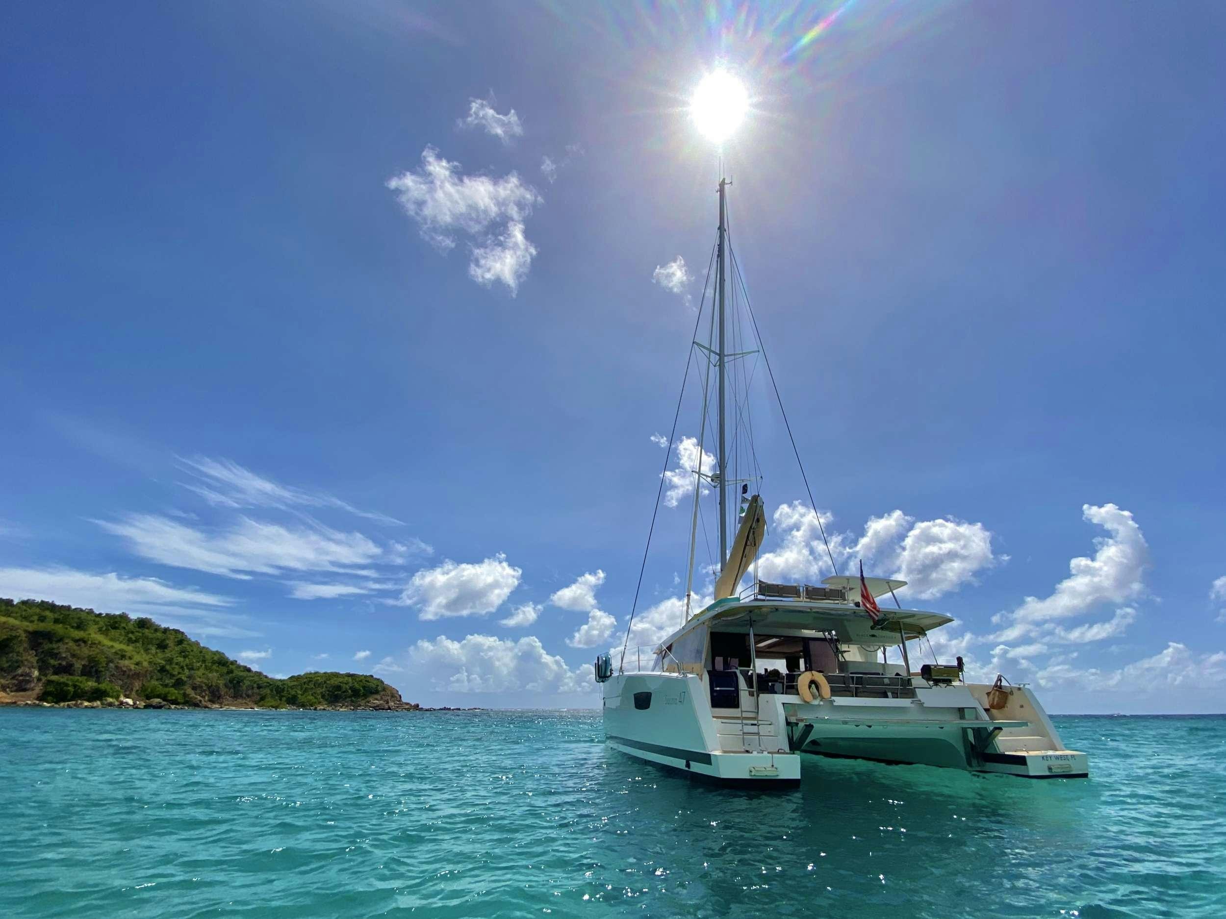a boat on the water aboard BLACK TORTUGA Yacht for Charter