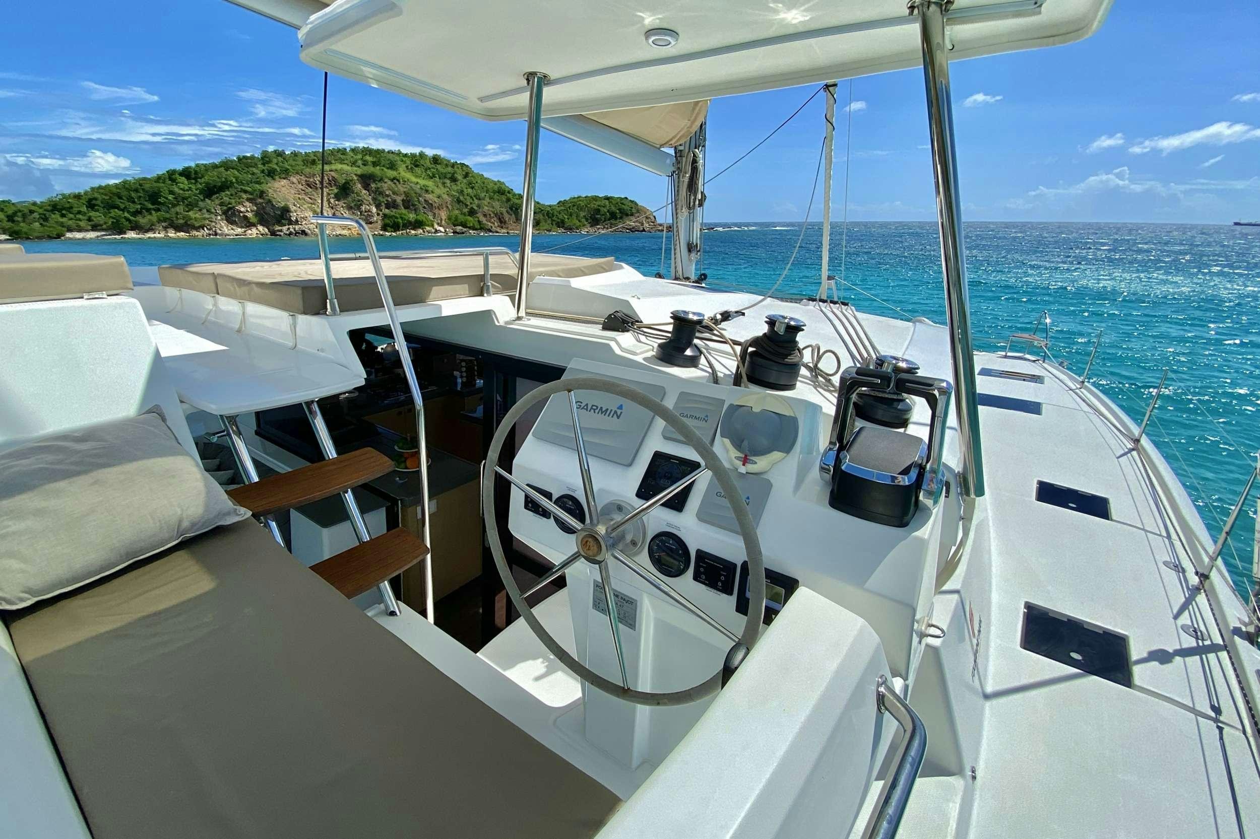 a boat on the water aboard BLACK TORTUGA Yacht for Charter