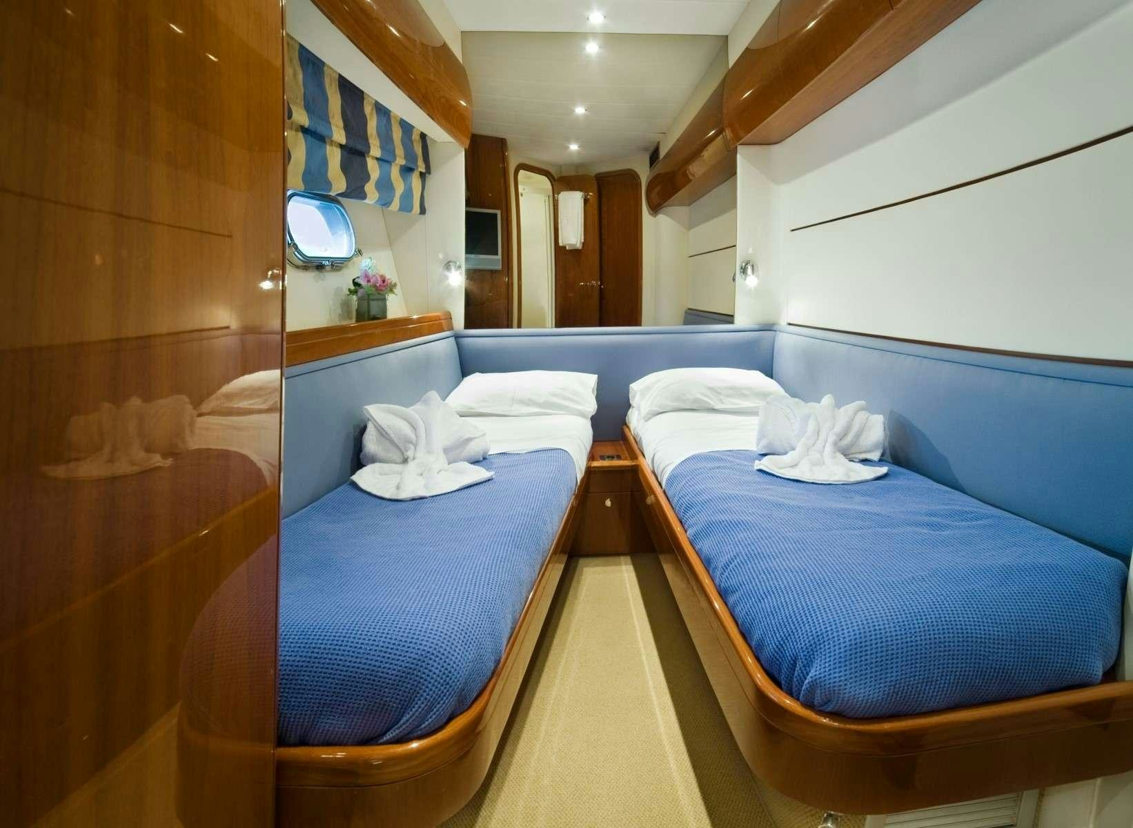 a room with two beds aboard FAST BREAK Yacht for Charter