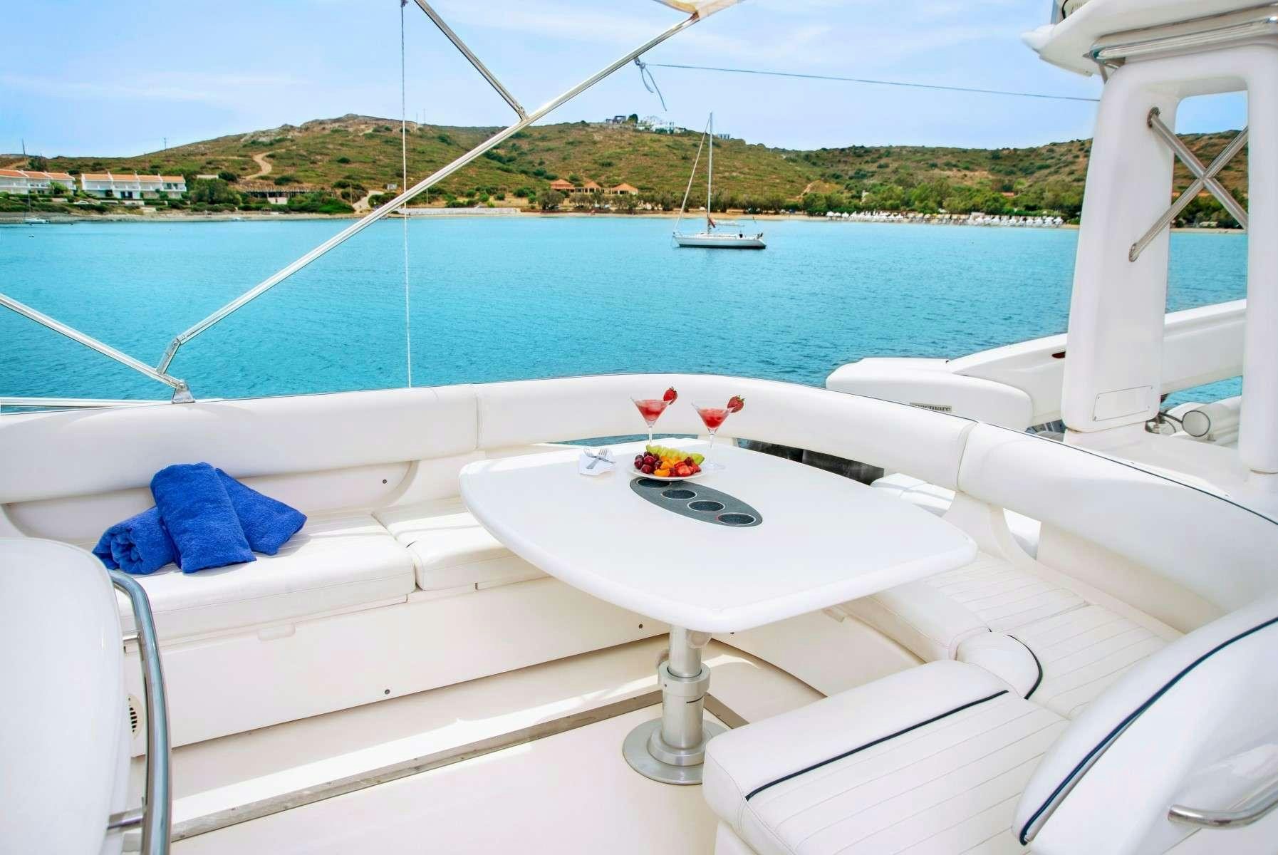 a white boat with a flower on it aboard FAST BREAK Yacht for Charter