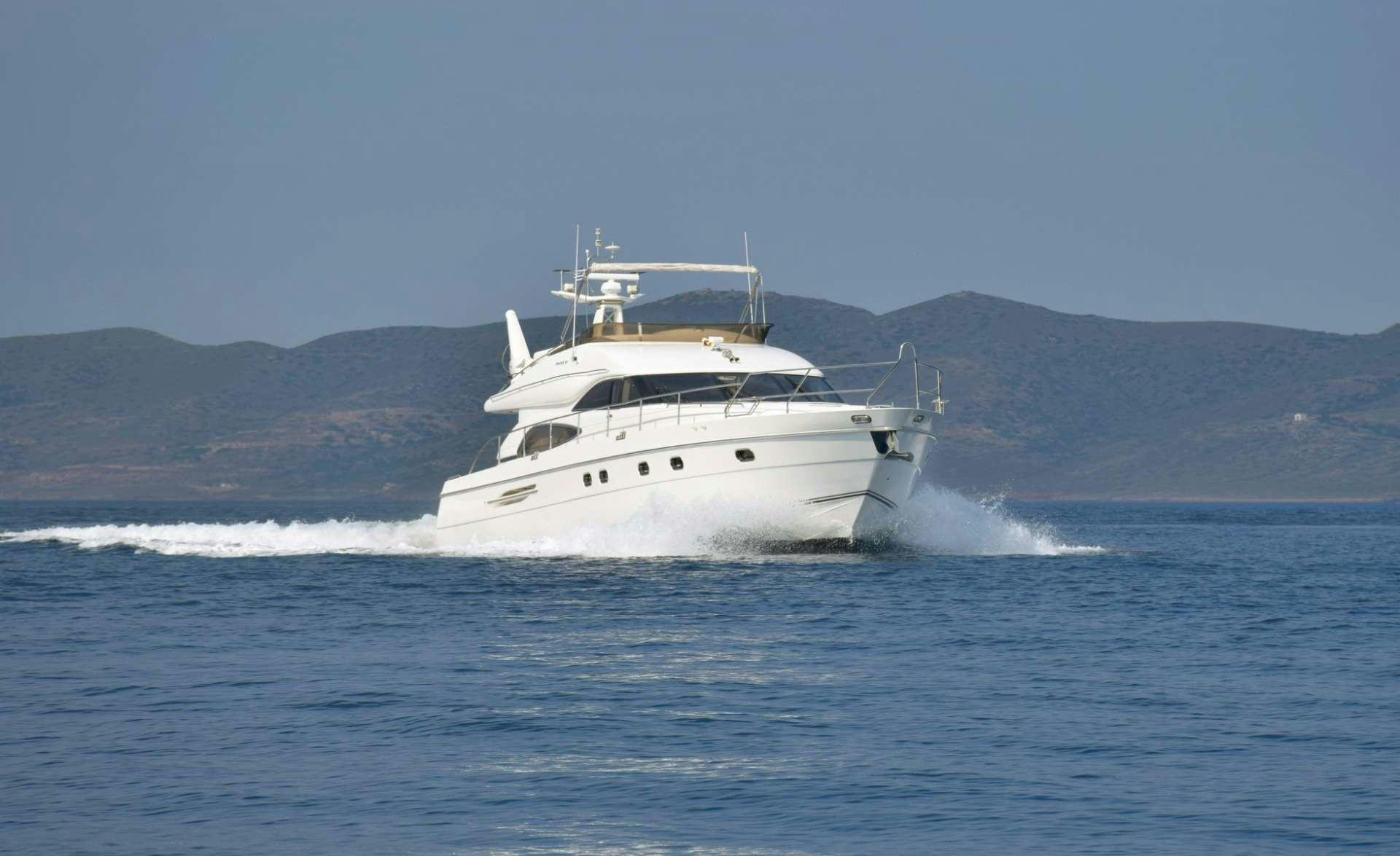 a white boat on the water aboard FAST BREAK Yacht for Charter