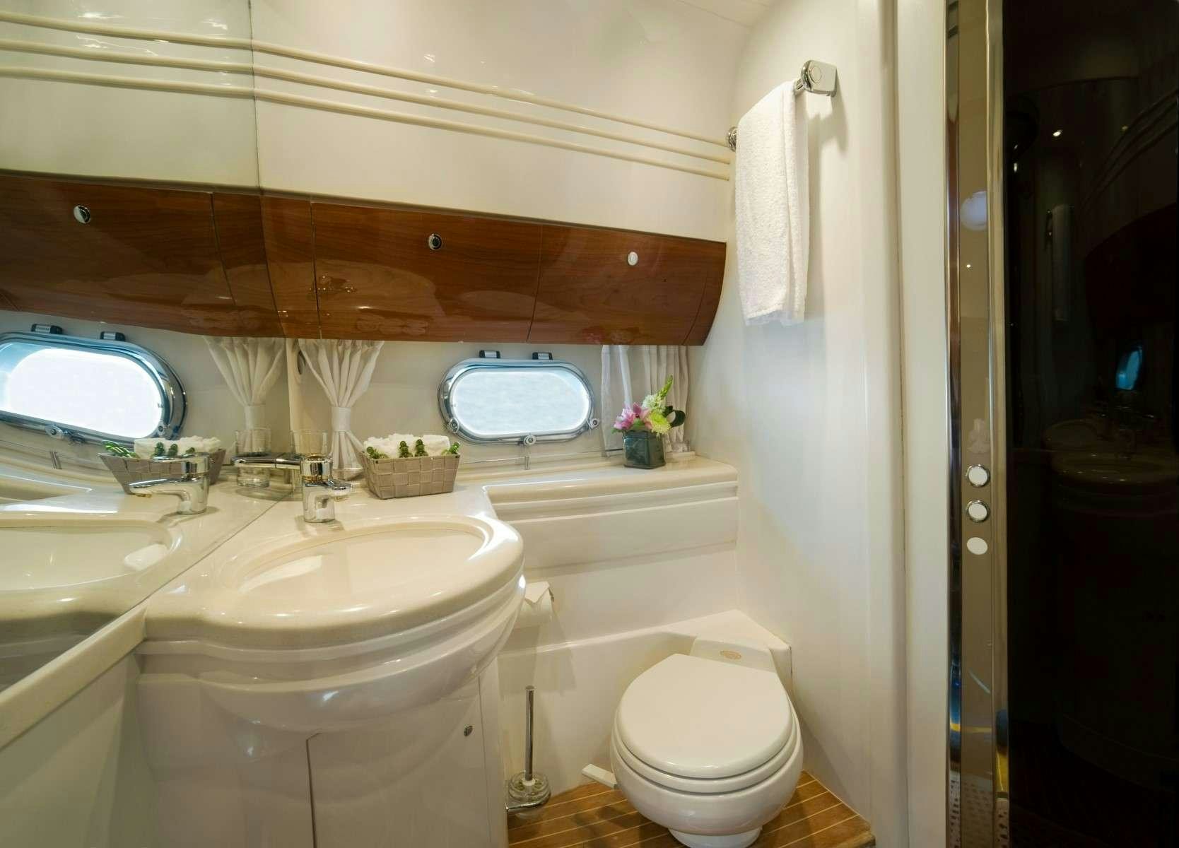 a bathroom with a sink and toilet aboard FAST BREAK Yacht for Charter