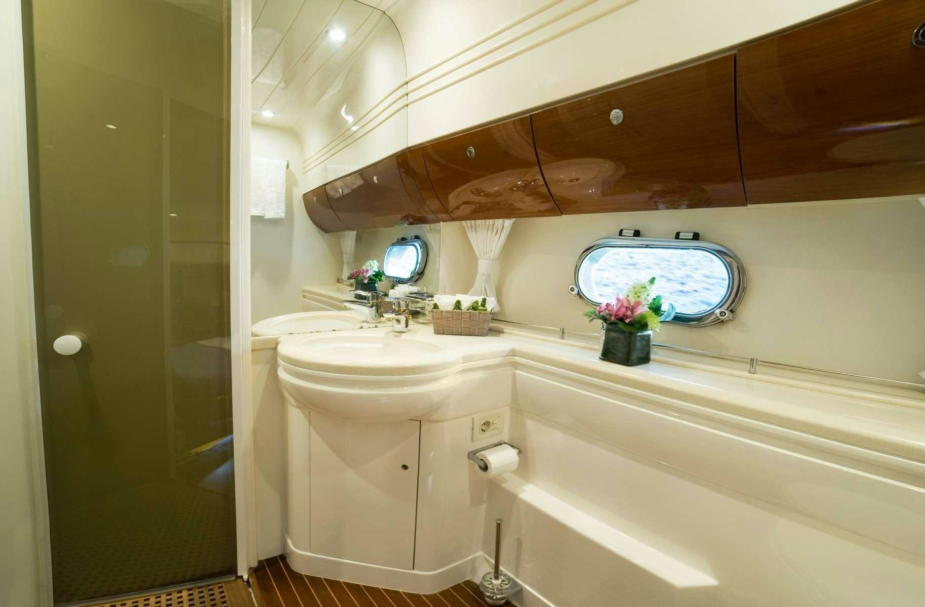 a bathroom with a large window aboard FAST BREAK Yacht for Charter
