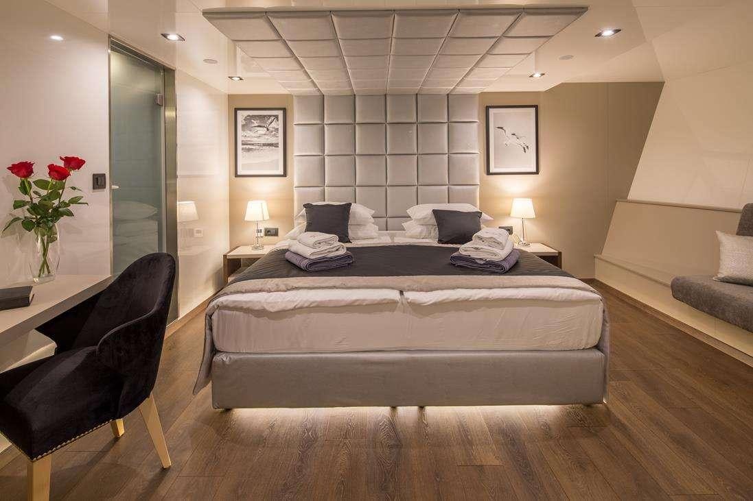 a bed in a hotel room aboard RARA AVIS Yacht for Charter