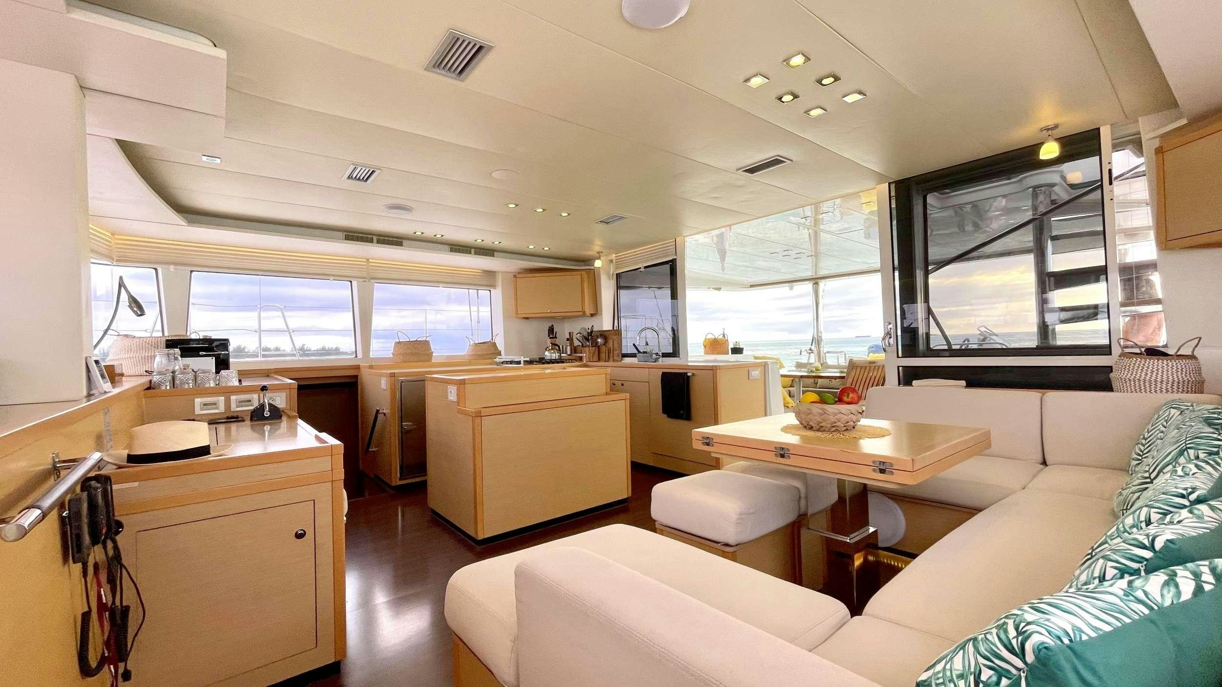 a room with a couch and a table aboard ZYLKENE 1 Yacht for Charter