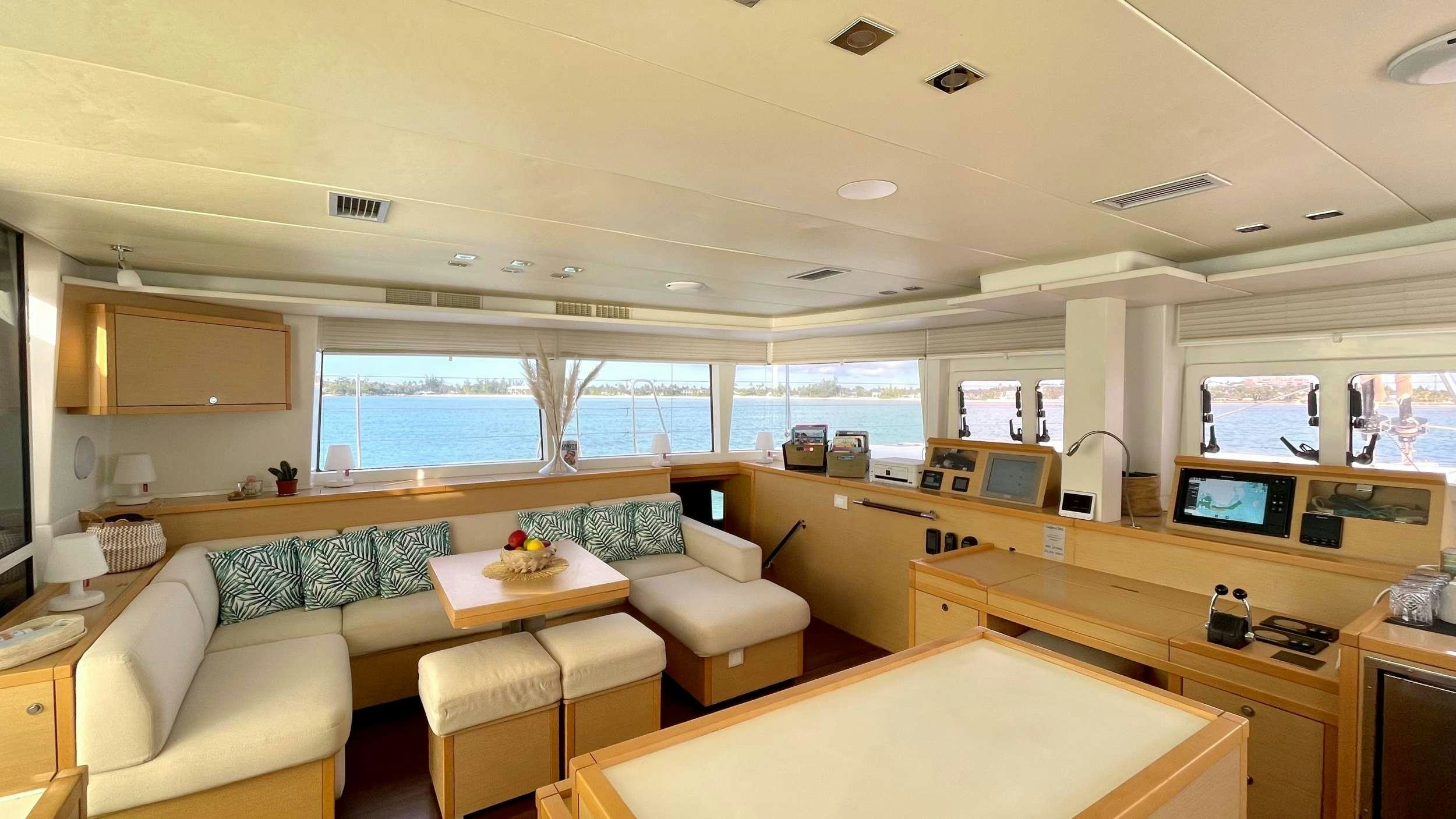 a room with a couch and a table aboard ZYLKENE 1 Yacht for Charter