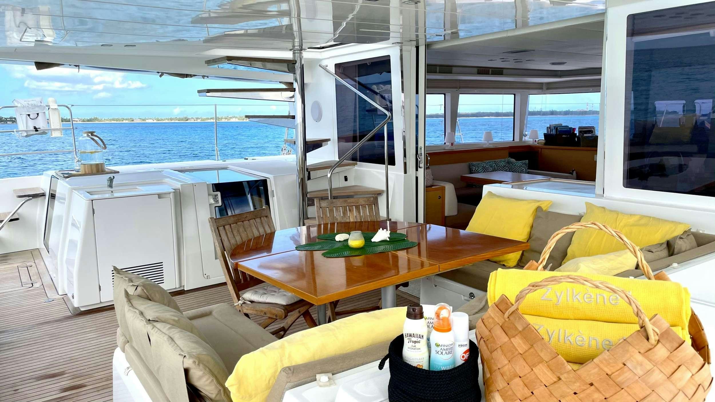 a room with a table and chairs aboard ZYLKENE 1 Yacht for Charter