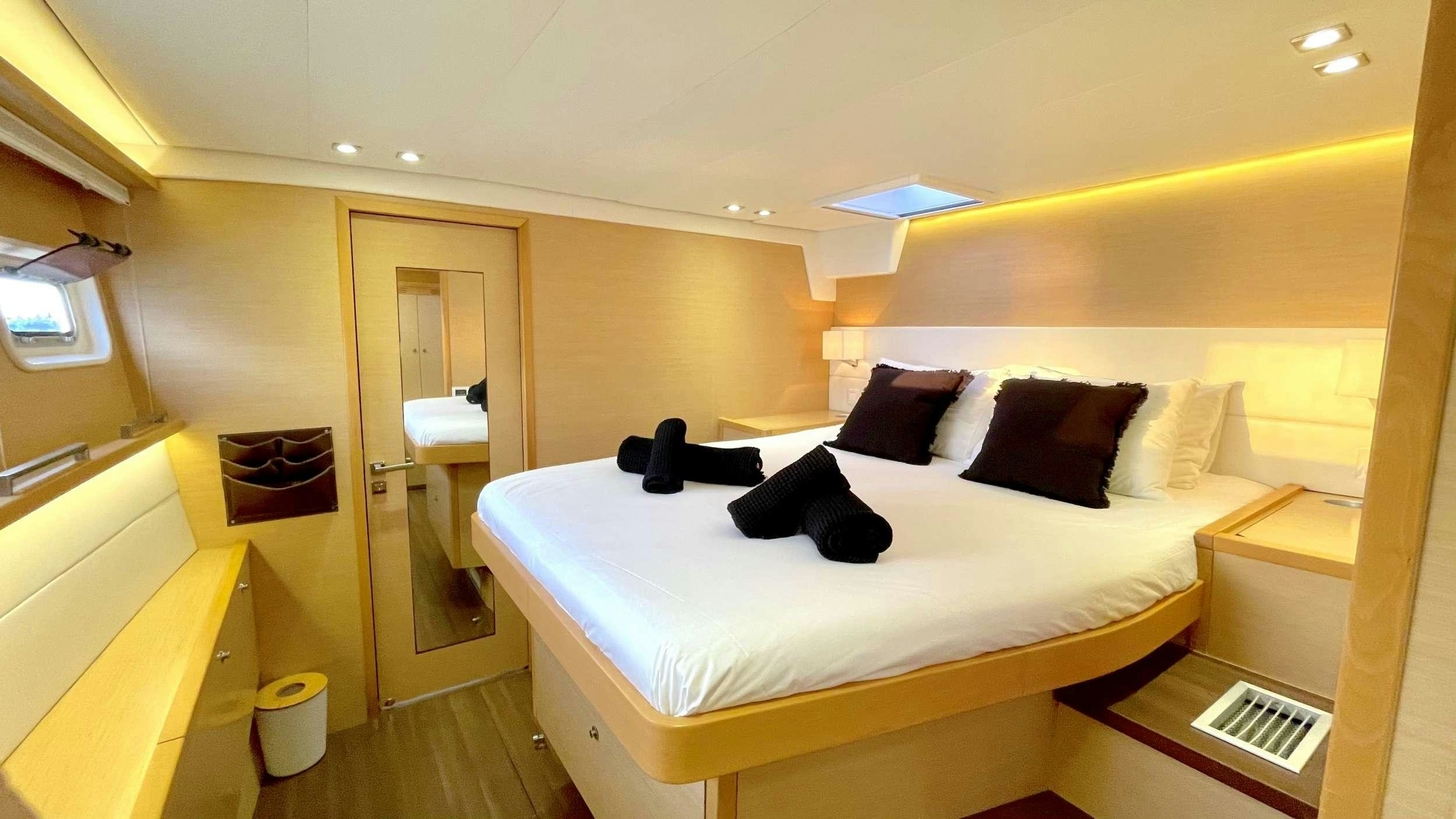 a bed in a room aboard ZYLKENE 1 Yacht for Charter