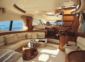a living room with a large window aboard EMMY Yacht for Charter