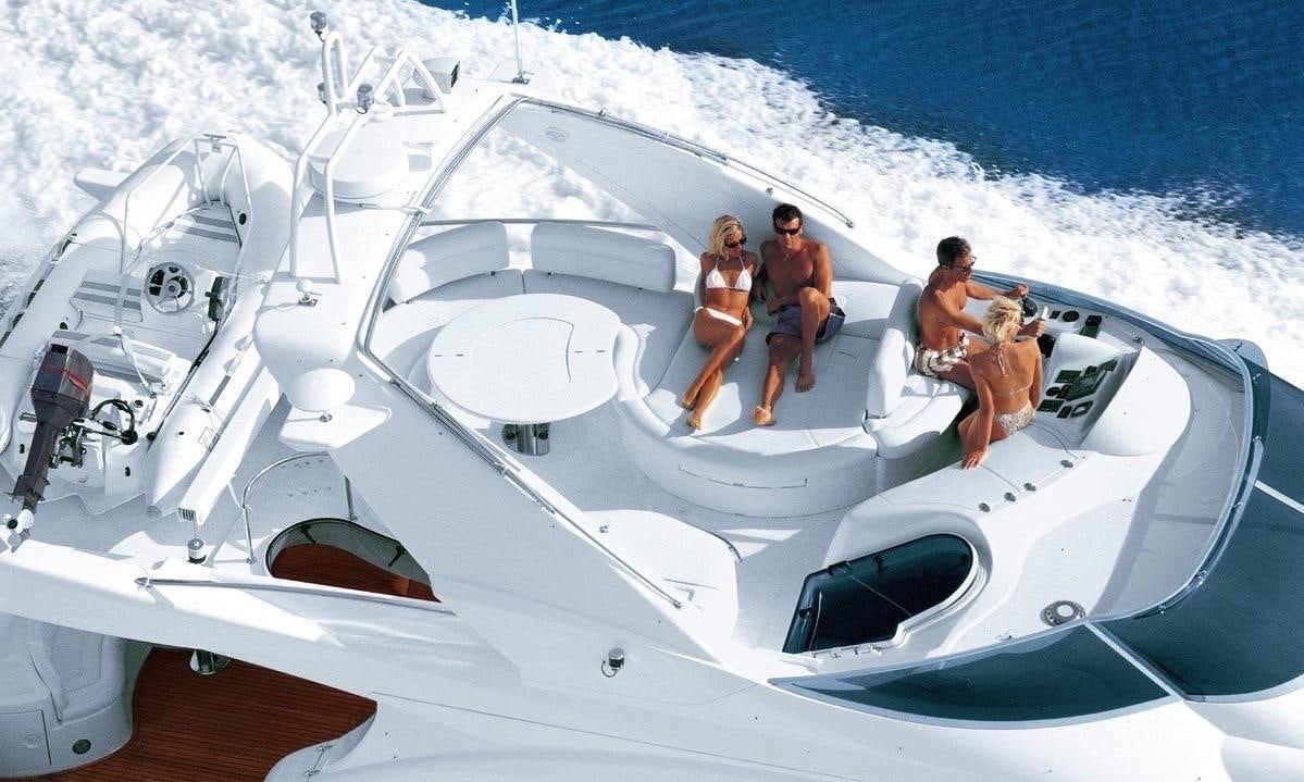 a group of people walking on a boat aboard EMMY Yacht for Charter